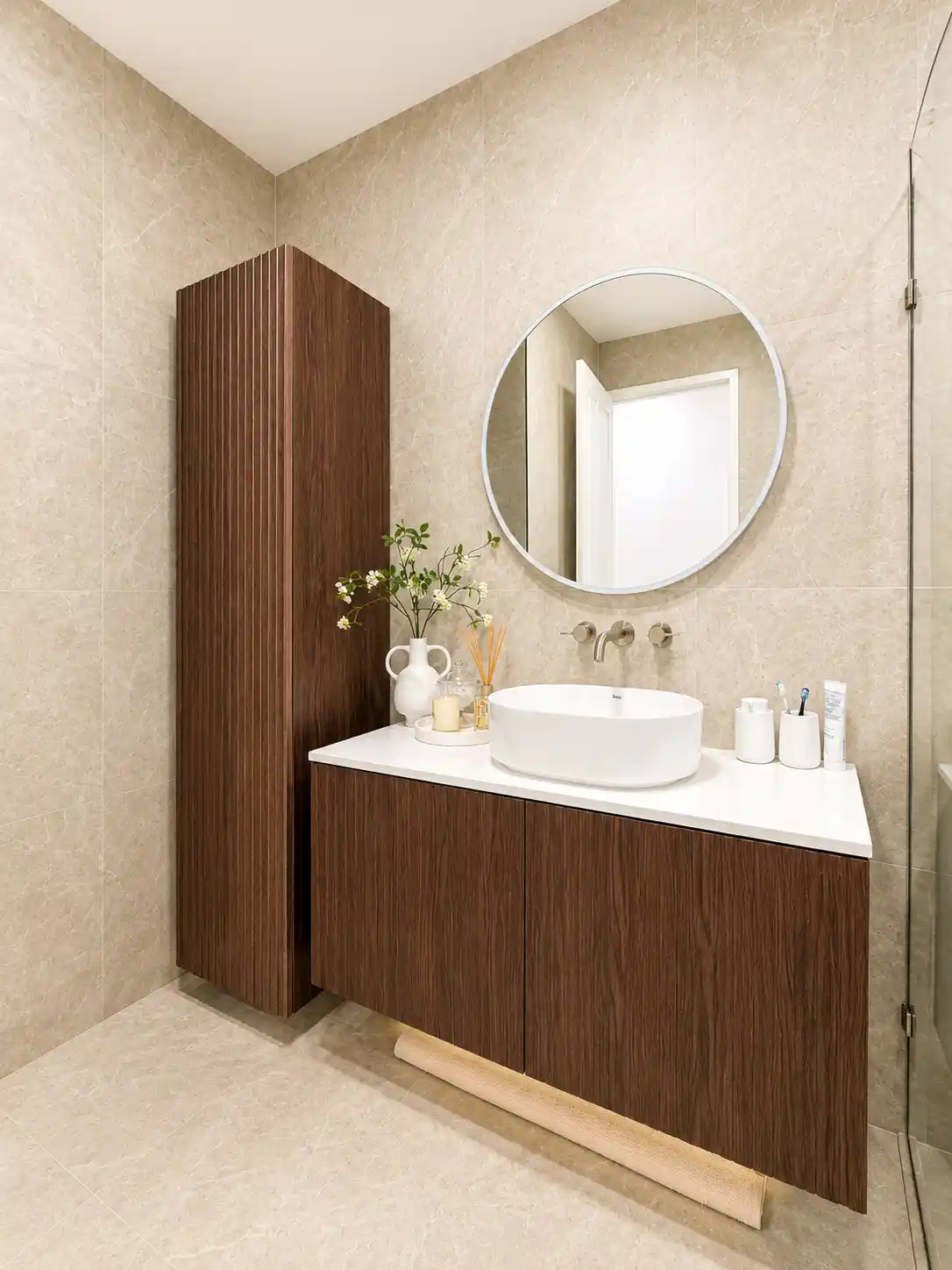 Walnut fluted vanity with round mirror